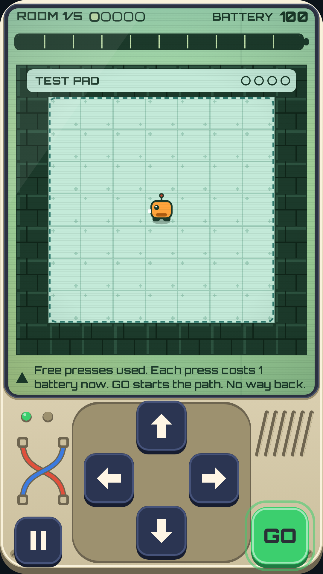 The test pad: a small robot in the middle of an empty square, four buttons below.